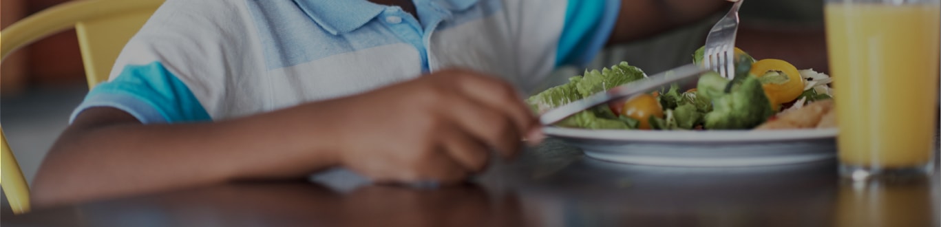 Child Eating Vegetables